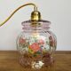 Vintage pink glass hand lamp with flower motifs