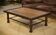 Brutalist coffee table made of wood and wrought iron from the 1960s.
