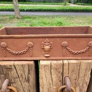 Rusty cast iron jardiniere planter