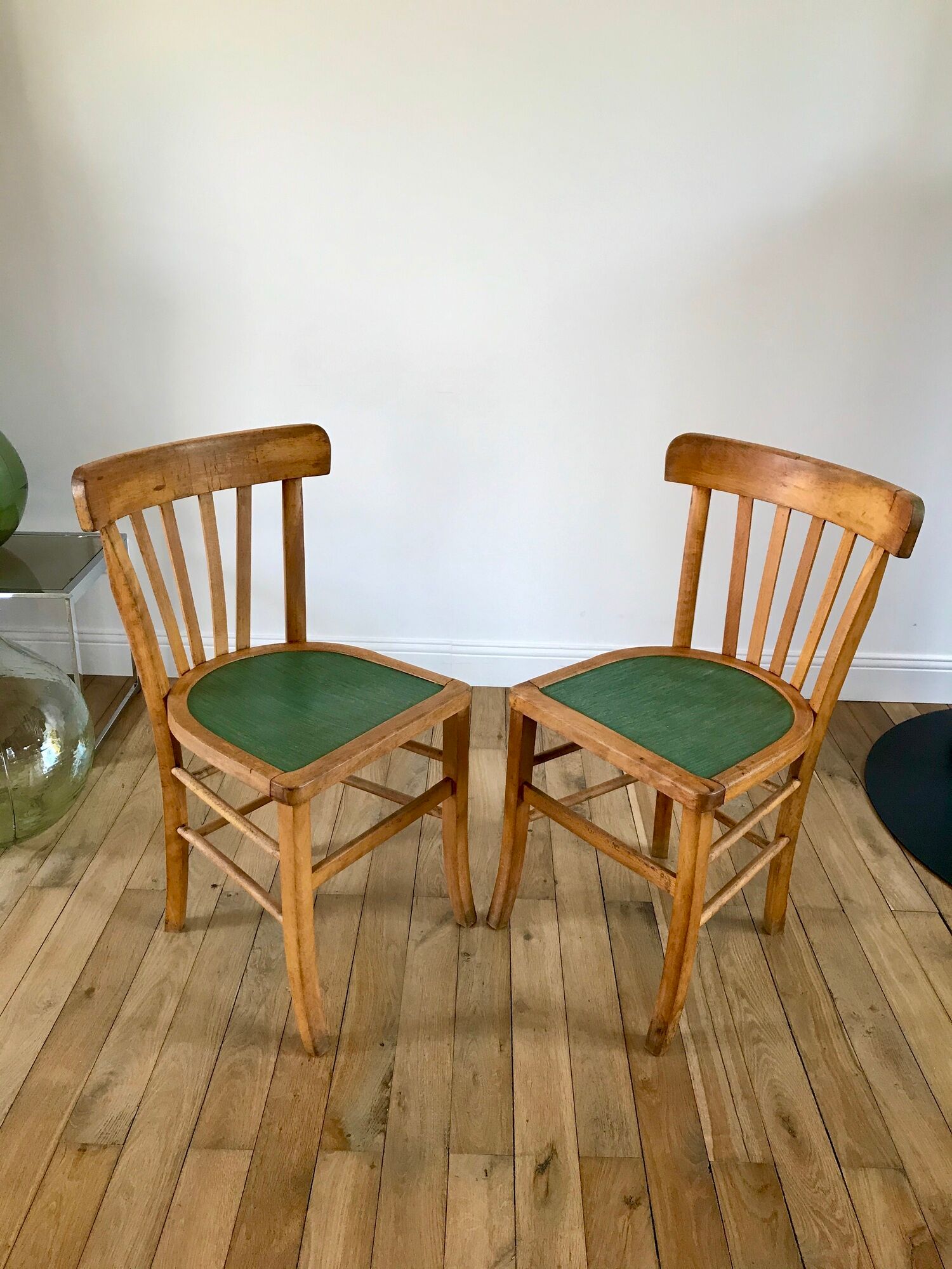Pair of bistro chairs in light curved wood and green seat 1950s