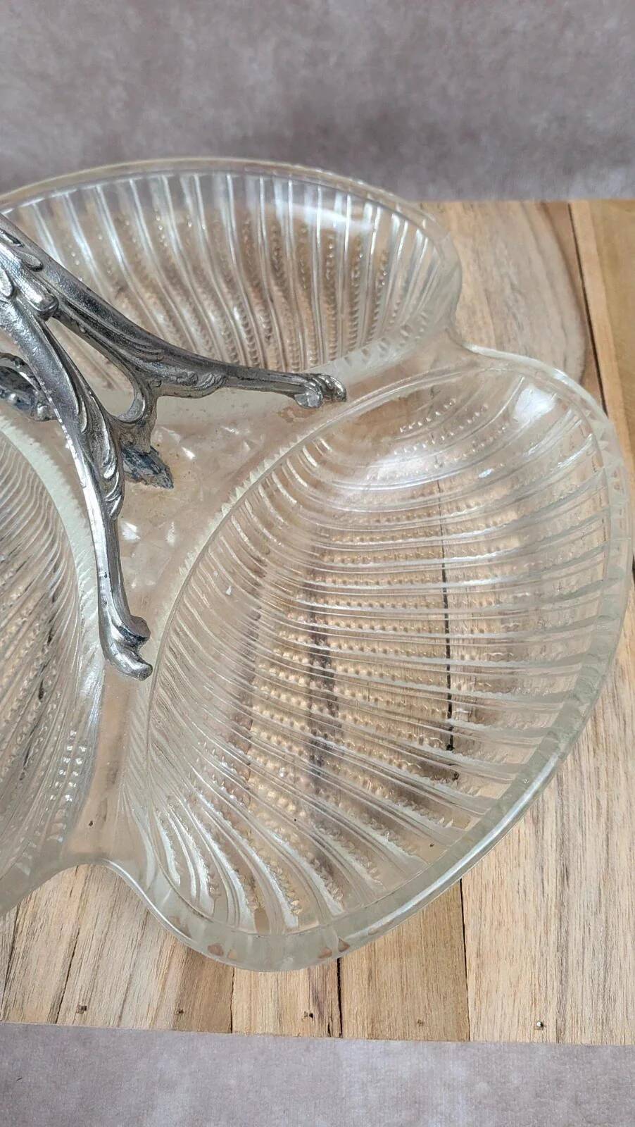 Vintage glass serving tray with silver-plated handle.
