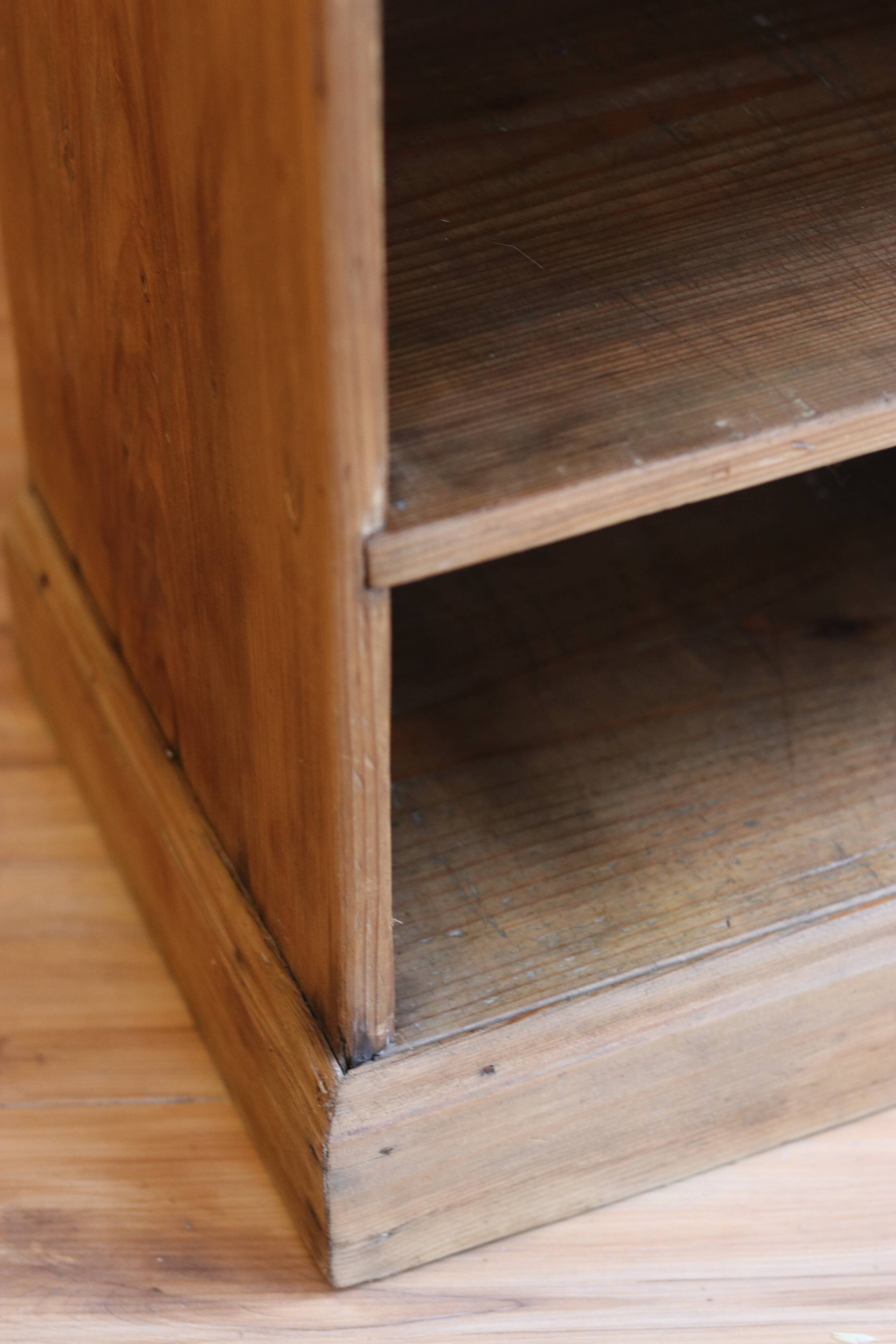 Large storage unit with compartments in waxed pine, early 20th century.