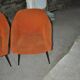 Pair of Mid-Century armchairs in black metal and orange fabric, VEB Sitzmöbelwerke, 1960s.