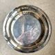 Round silver-plated metal dish