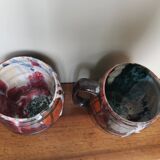 Set of 2 vintage enameled ceramic slip mug mugs signed Safi