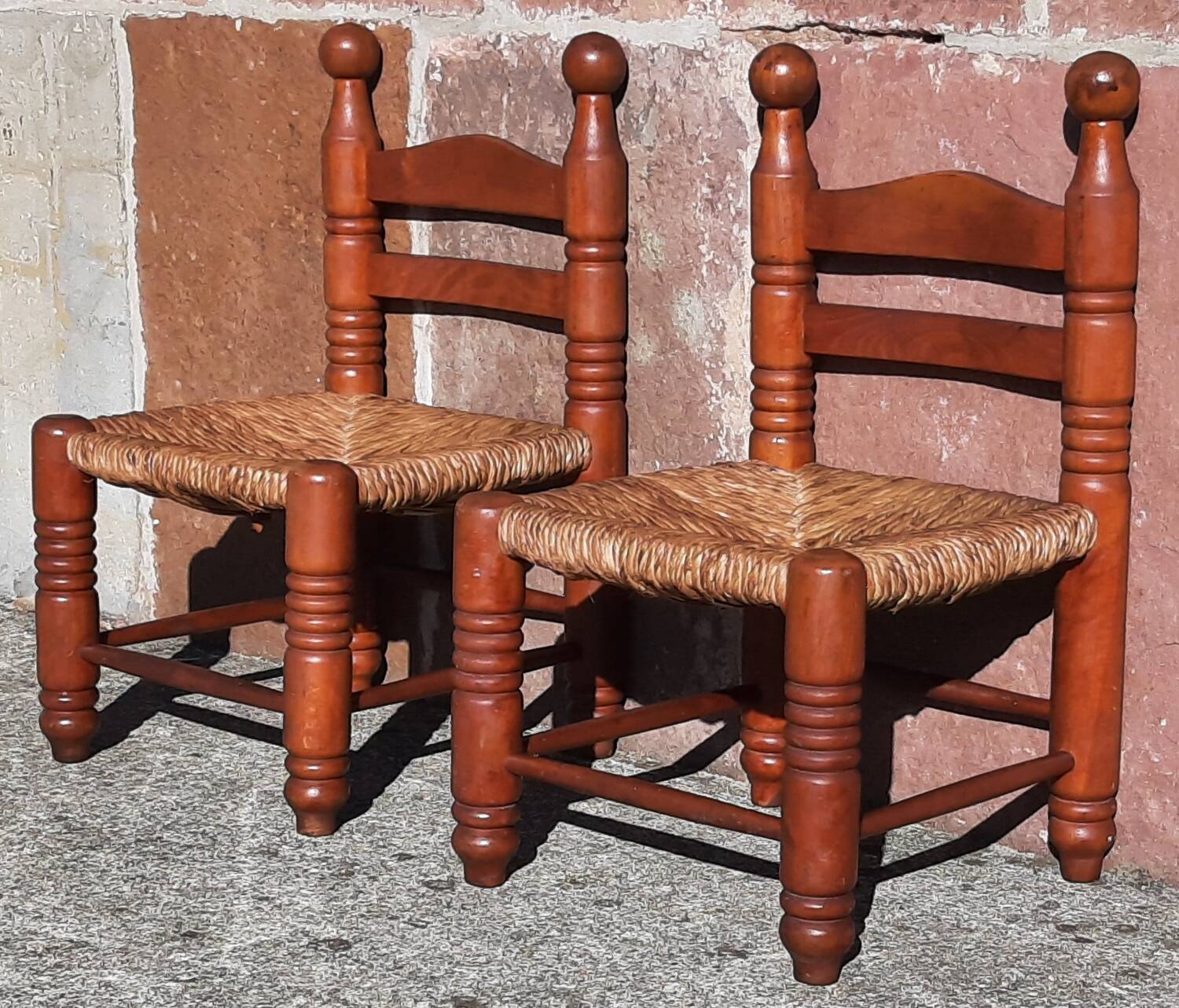Pair of low armchairs by the fireplace. (Straw seat)