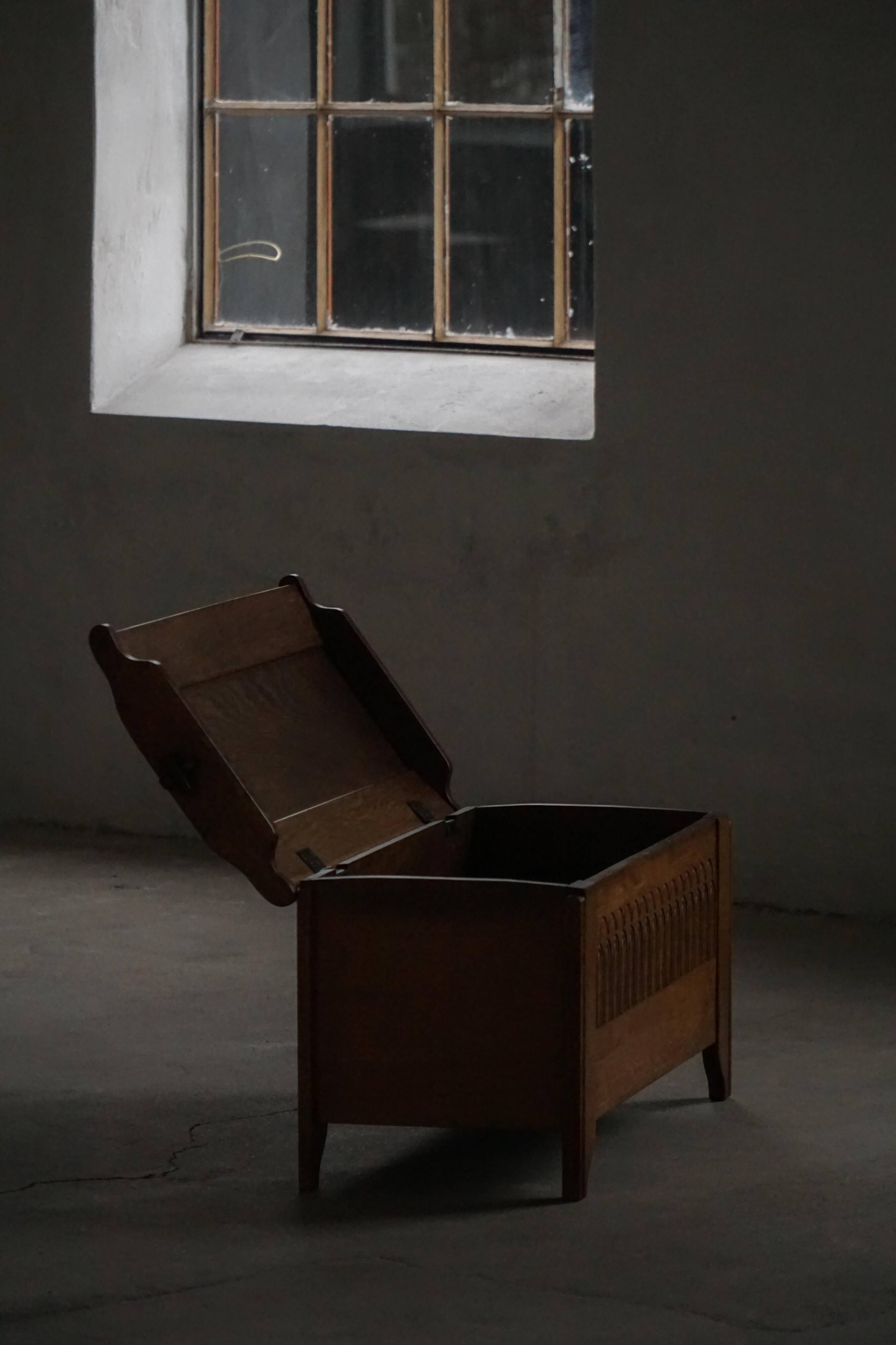 Modern Danish oak commode with decorative relief sculpture, mid-20th century.