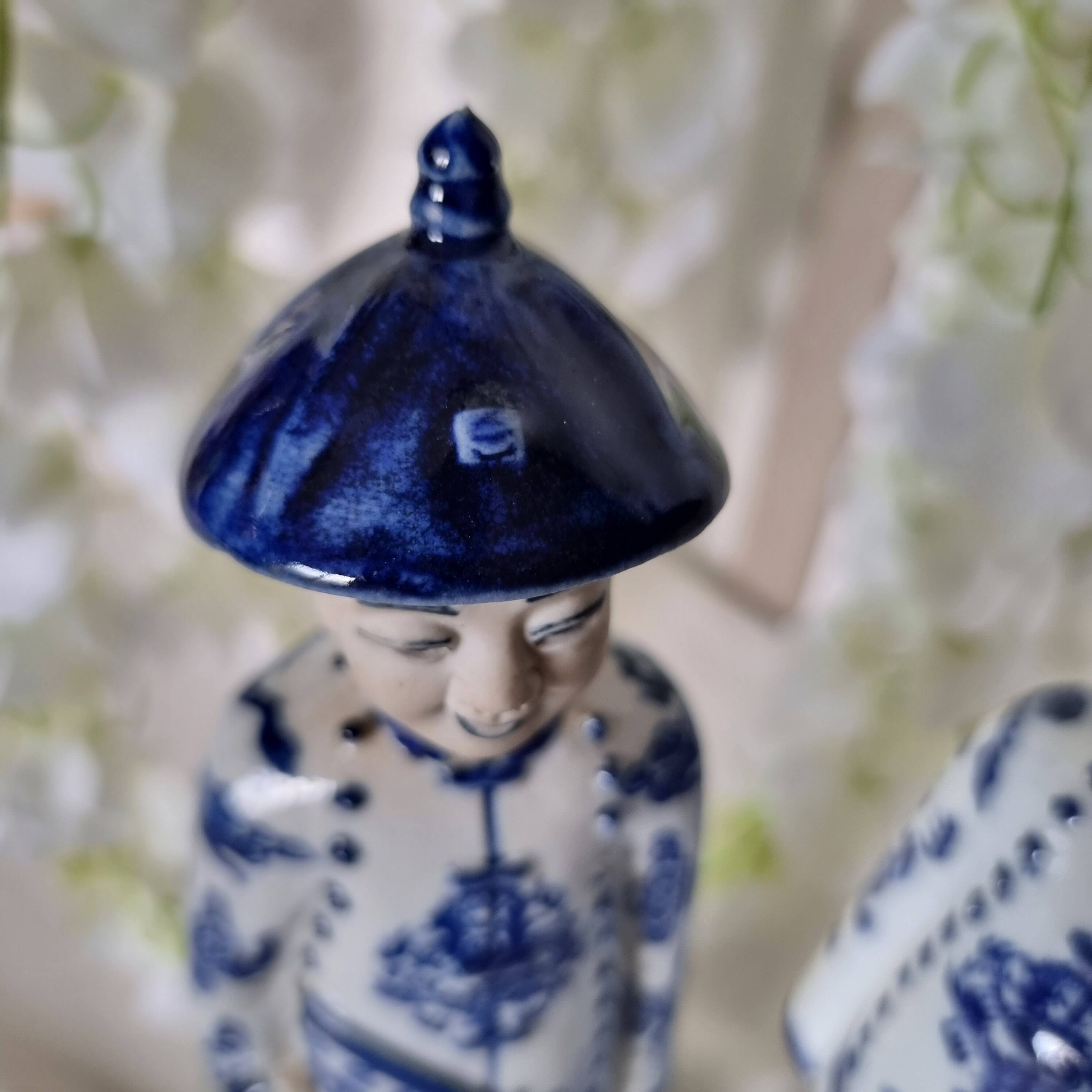 Pair of vintage Chinese blue and white porcelain figurines depicting
