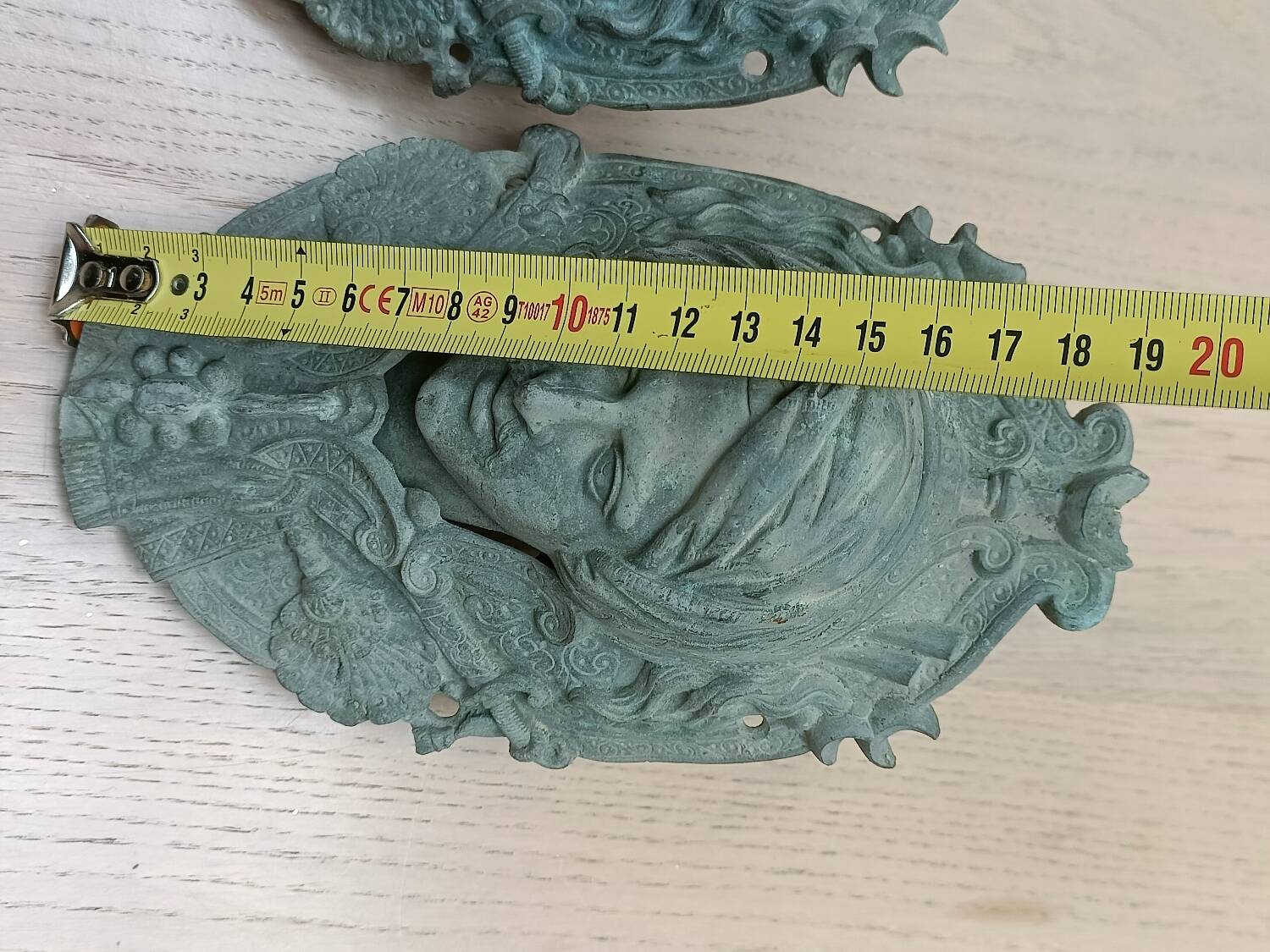 Bronze door knockers and billiard table corners