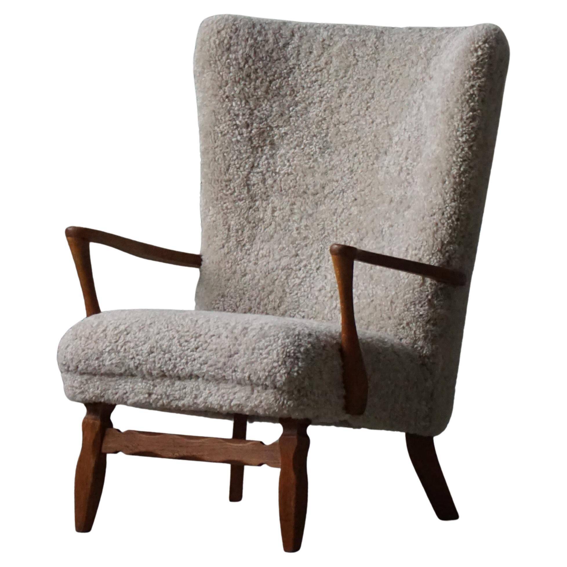 Viggo Boesen, high-back chair in oak and shearling lambskin, modern Danish design, 1950s.