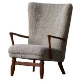 Viggo Boesen, high-back chair in oak and shearling lambskin, modern Danish design, 1950s.