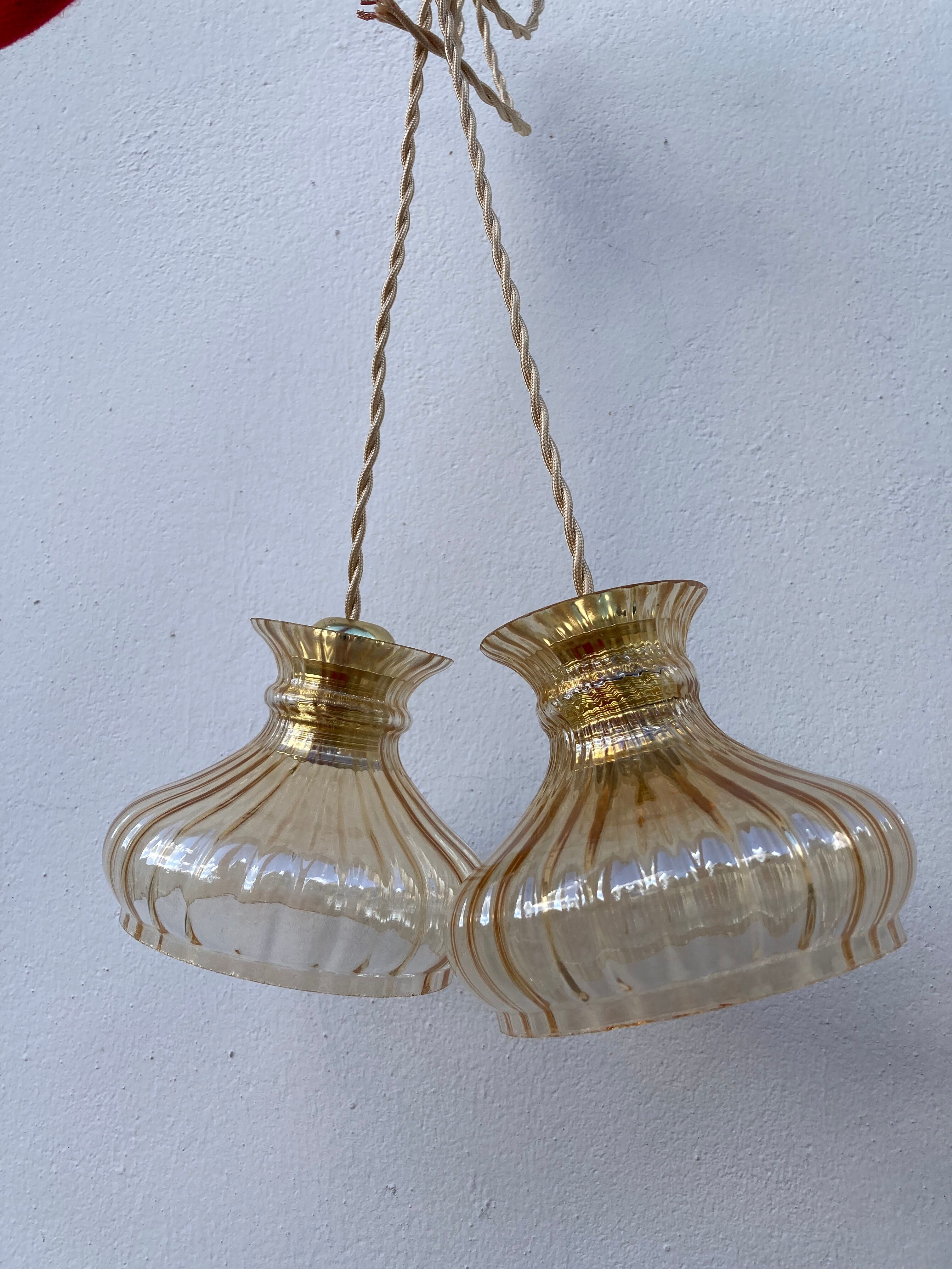 Pair of amber glass walkmen to hang in suspension