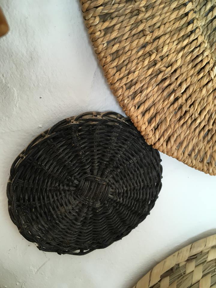 Wall composition of seven baskets and wicker trays