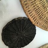 Wall composition of seven baskets and wicker trays