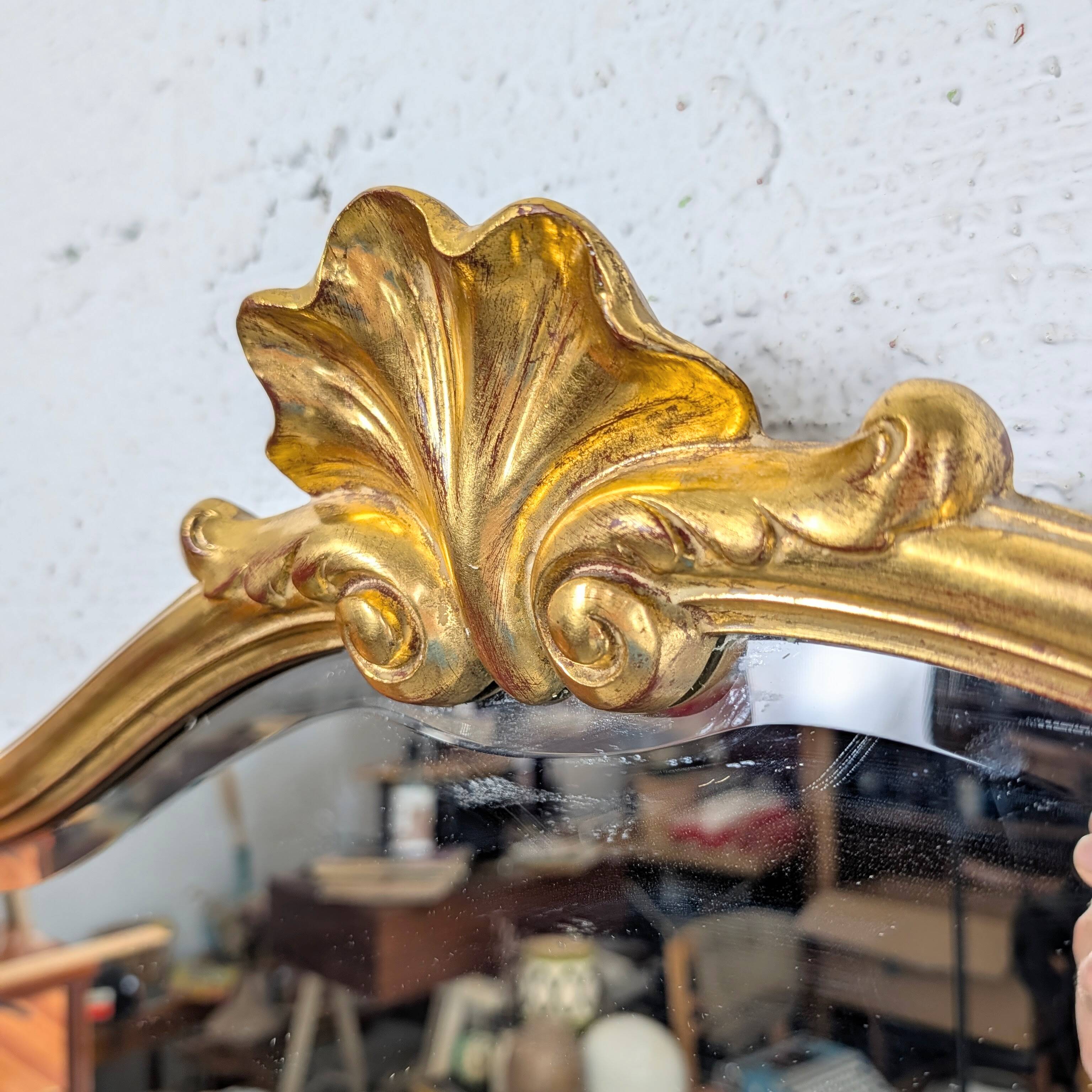 Louis-Philippe gilded mirror with shell pediment