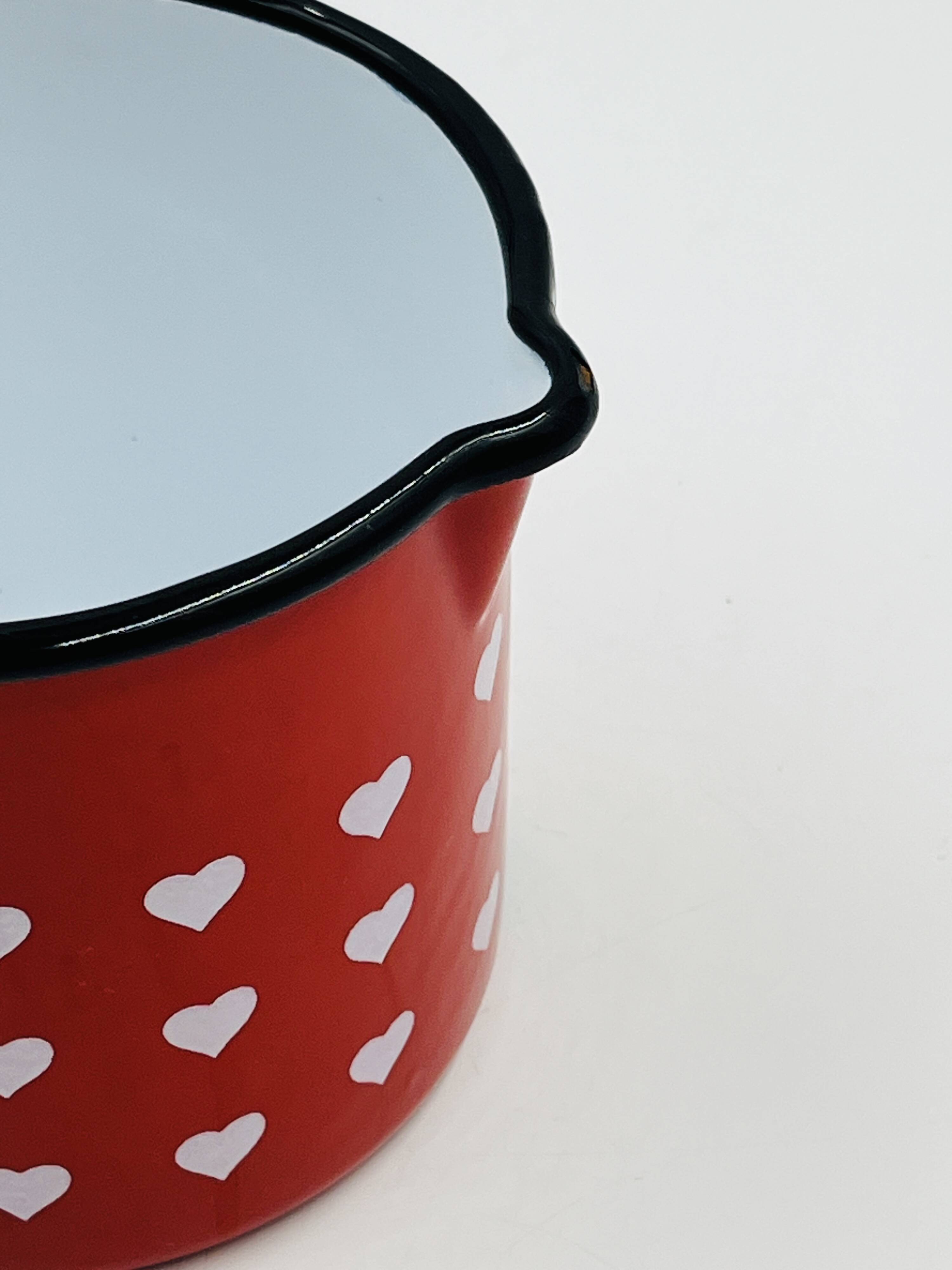 Vintage red enamelled measuring jug with hearts