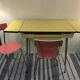 Table formica yellow and 2 red chairs