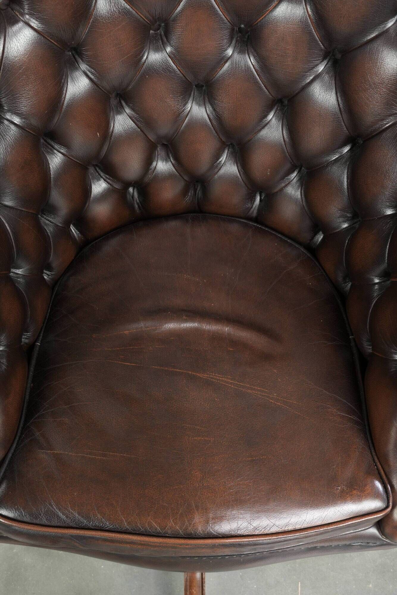 Brown cow leather Chesterfield office chair on wheels in English style