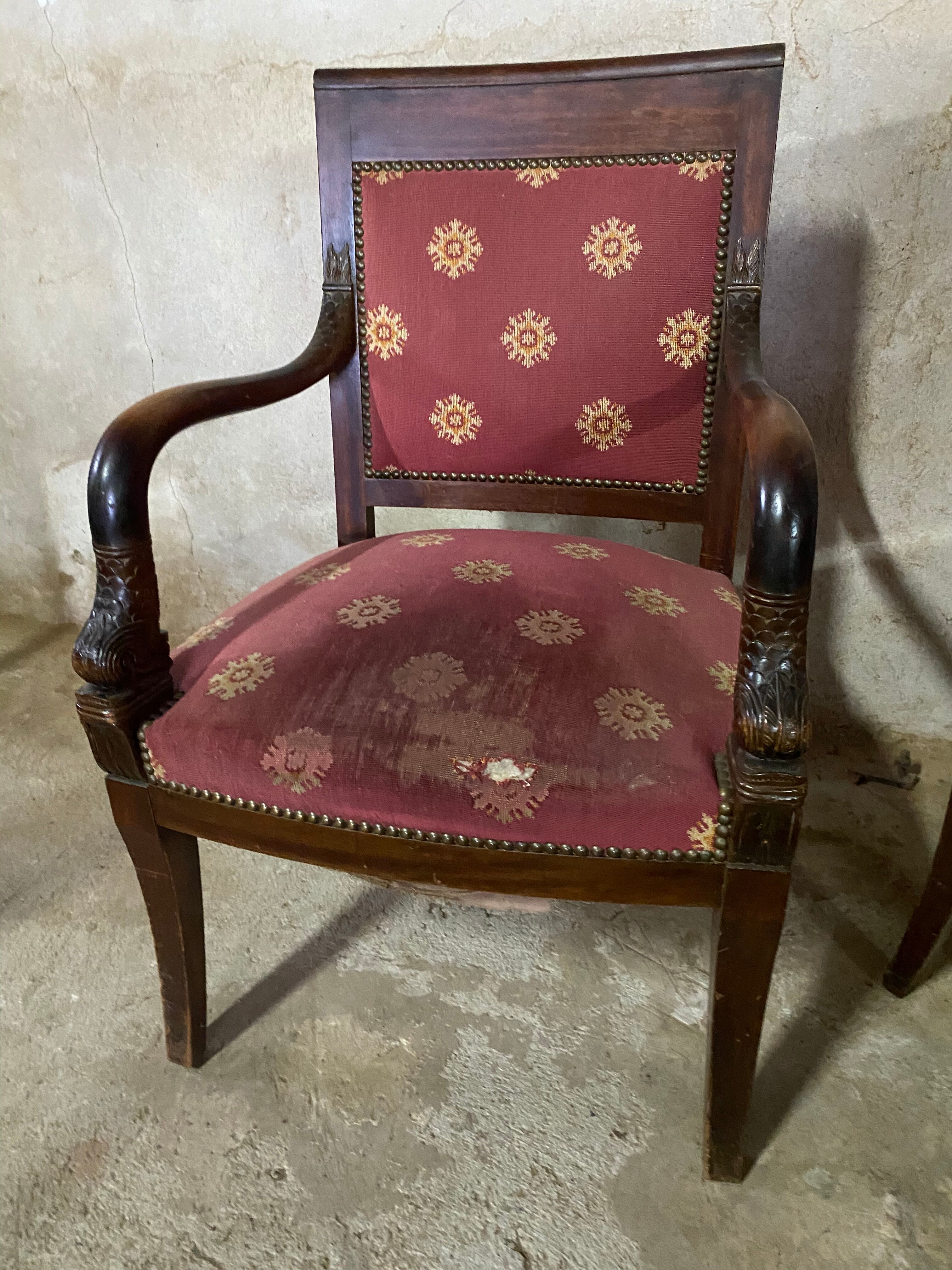 Pair of empire-style armchairs with dolphins