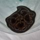 Handcrafted glass fruit bowl with ribbed design set with pewter medallions.