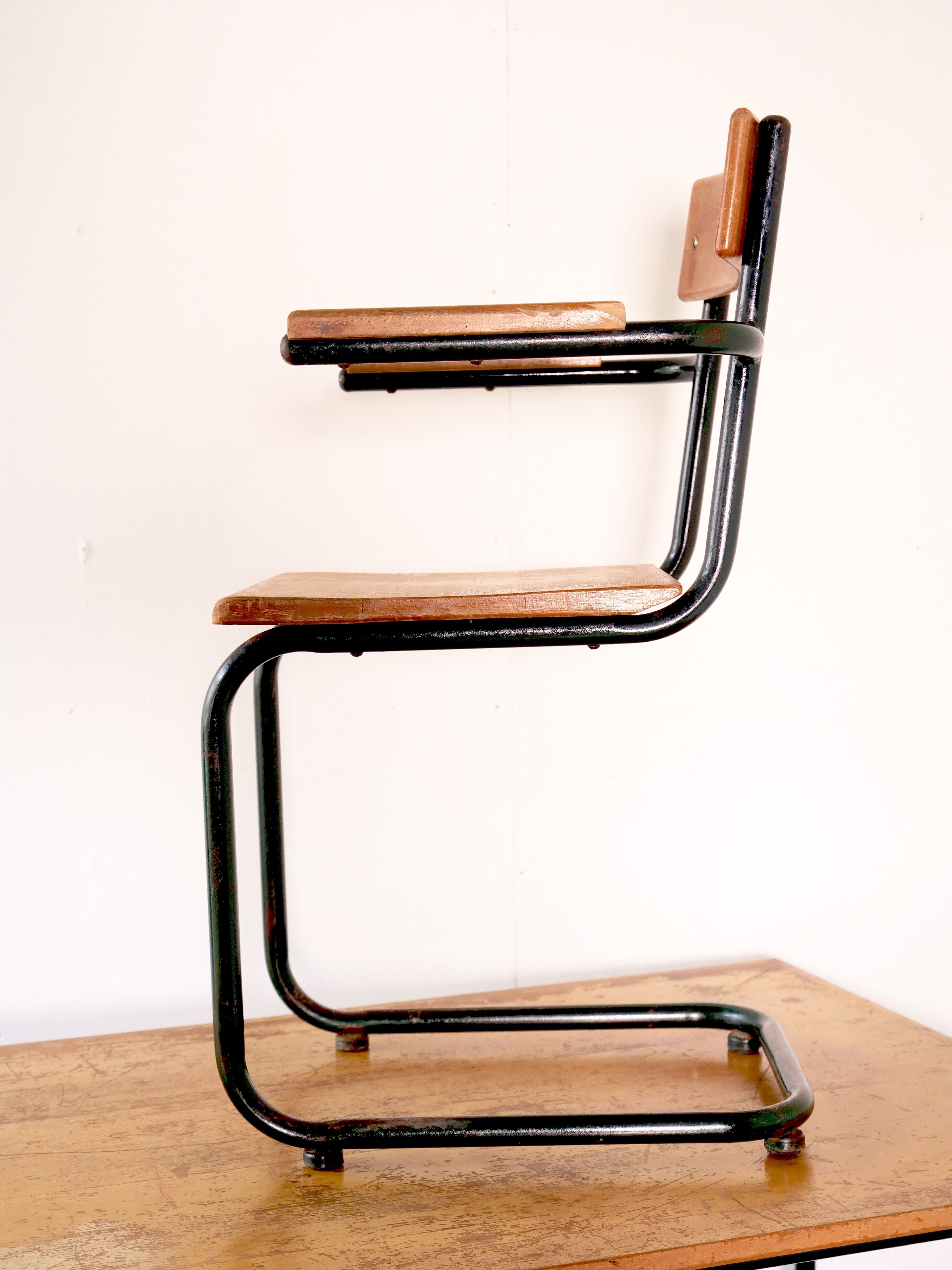 Desk with bauhaus style tubular steel chair
