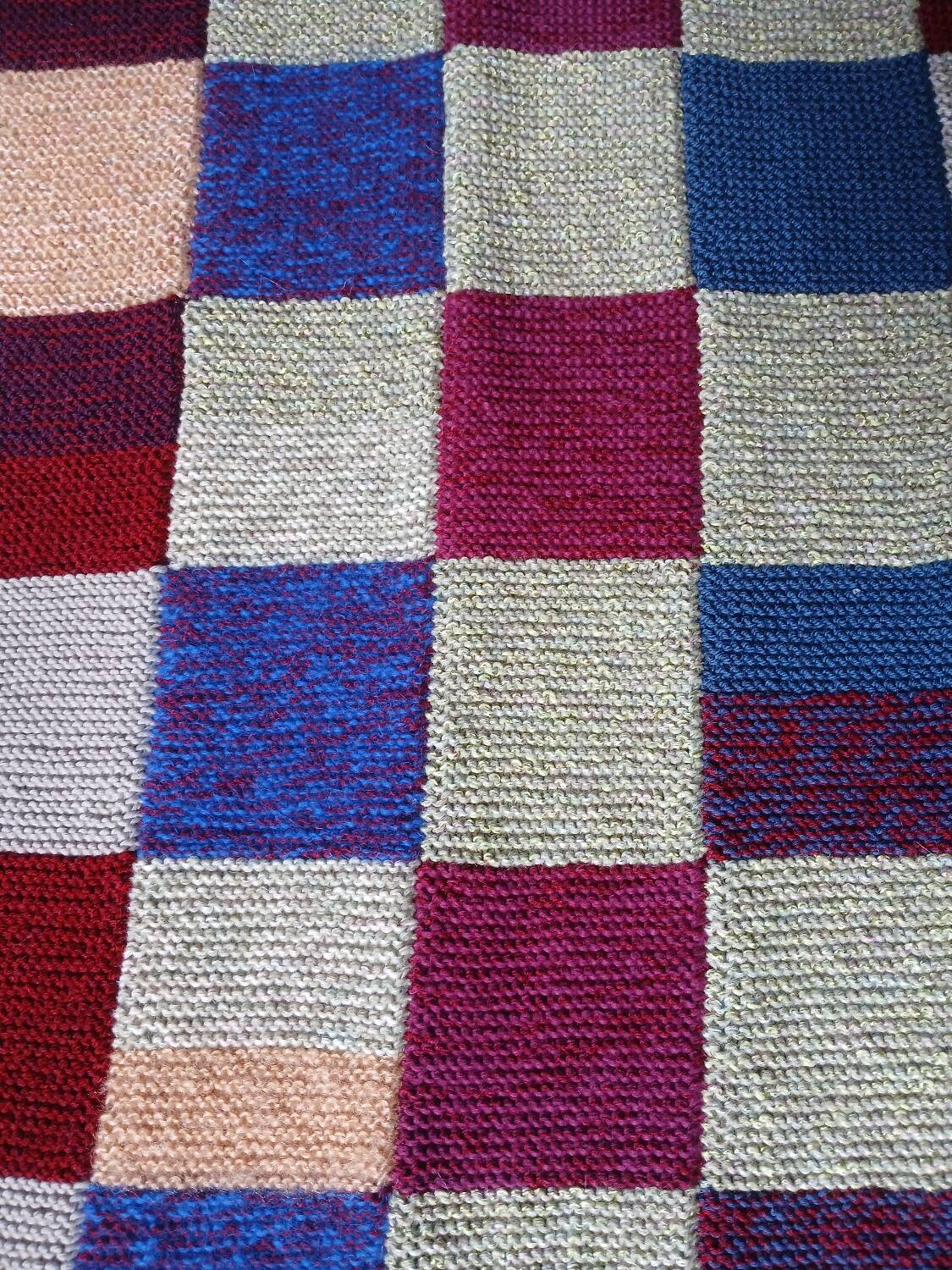 Hand knitted patchwork plaid