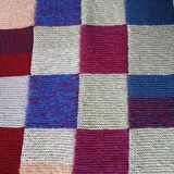 Hand knitted patchwork plaid
