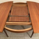 Scandinavian round teak dining table from the 60s extendable