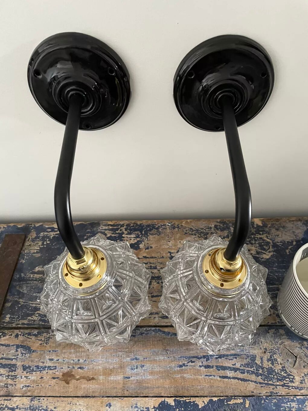 Set of two chiseled glass sconces