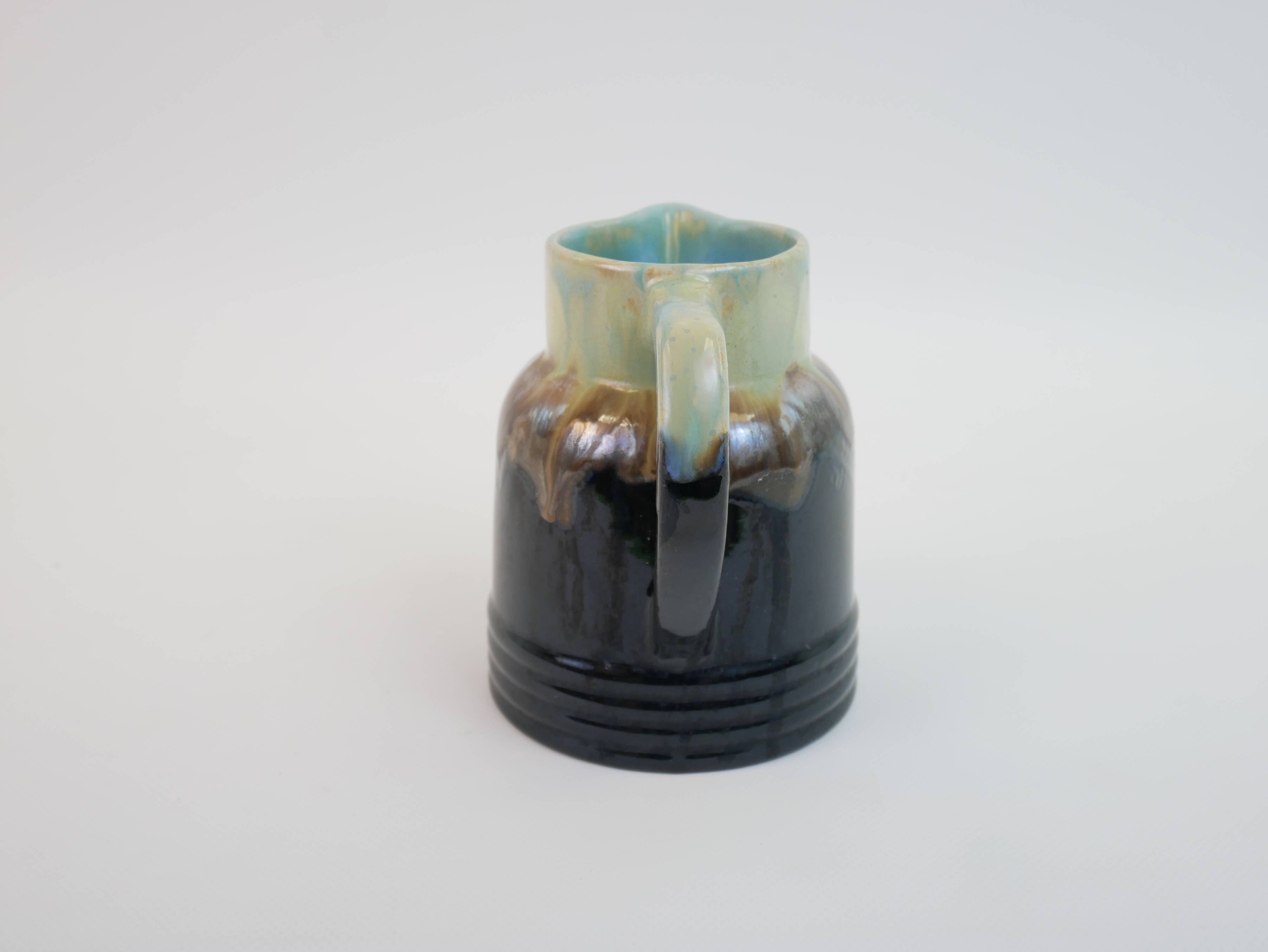 Art Deco pitcher in black, brown and blue glazed ceramic