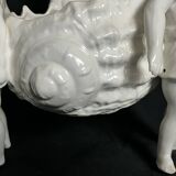 Porcelain, centerpiece with candle holder decorated with putti, 20th century