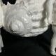 Porcelain, centerpiece with candle holder decorated with putti, 20th century
