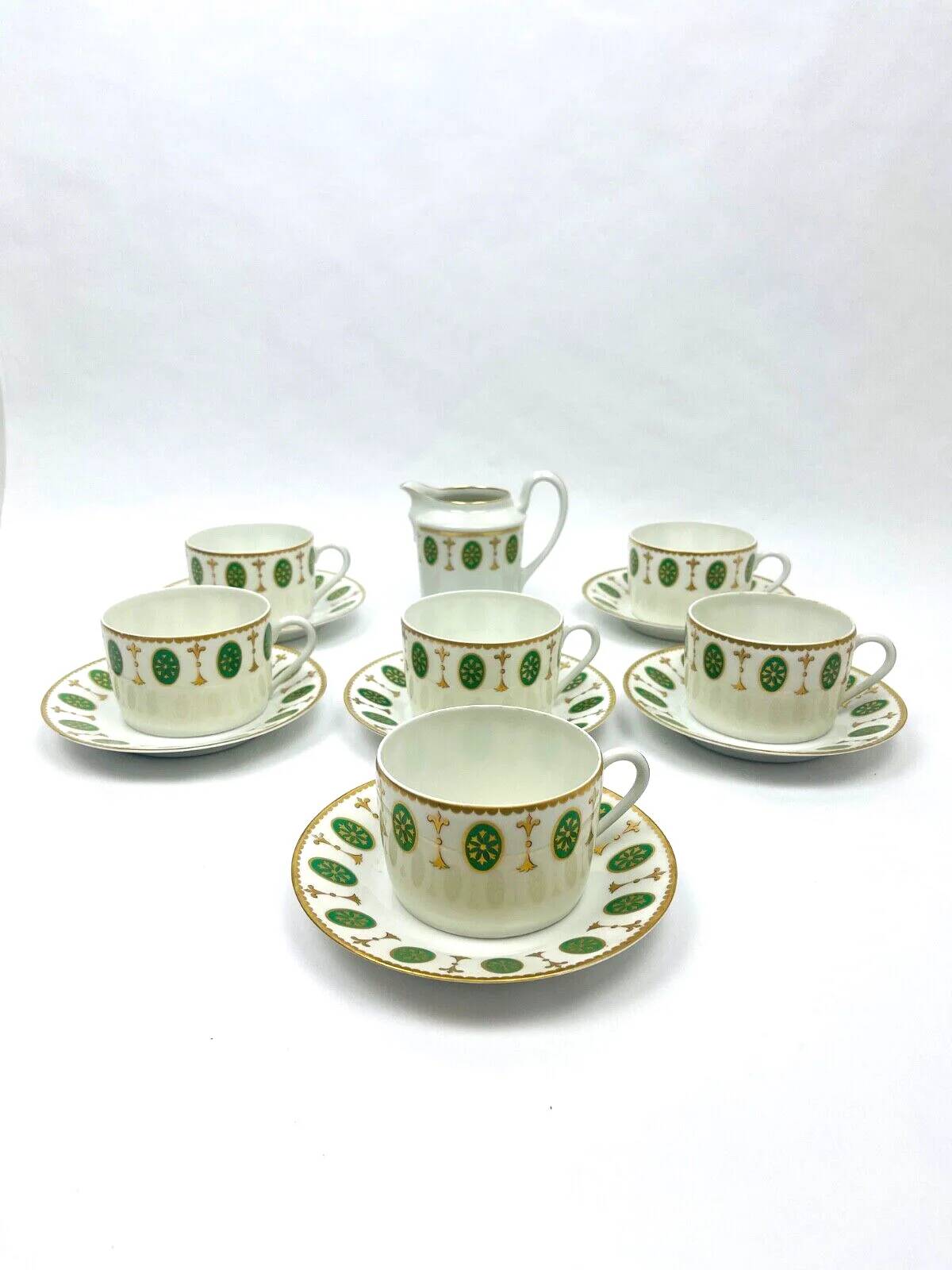 Set of 6 tea cups and 1 cream jug in Paris porcelain, Louis XVI decoration.