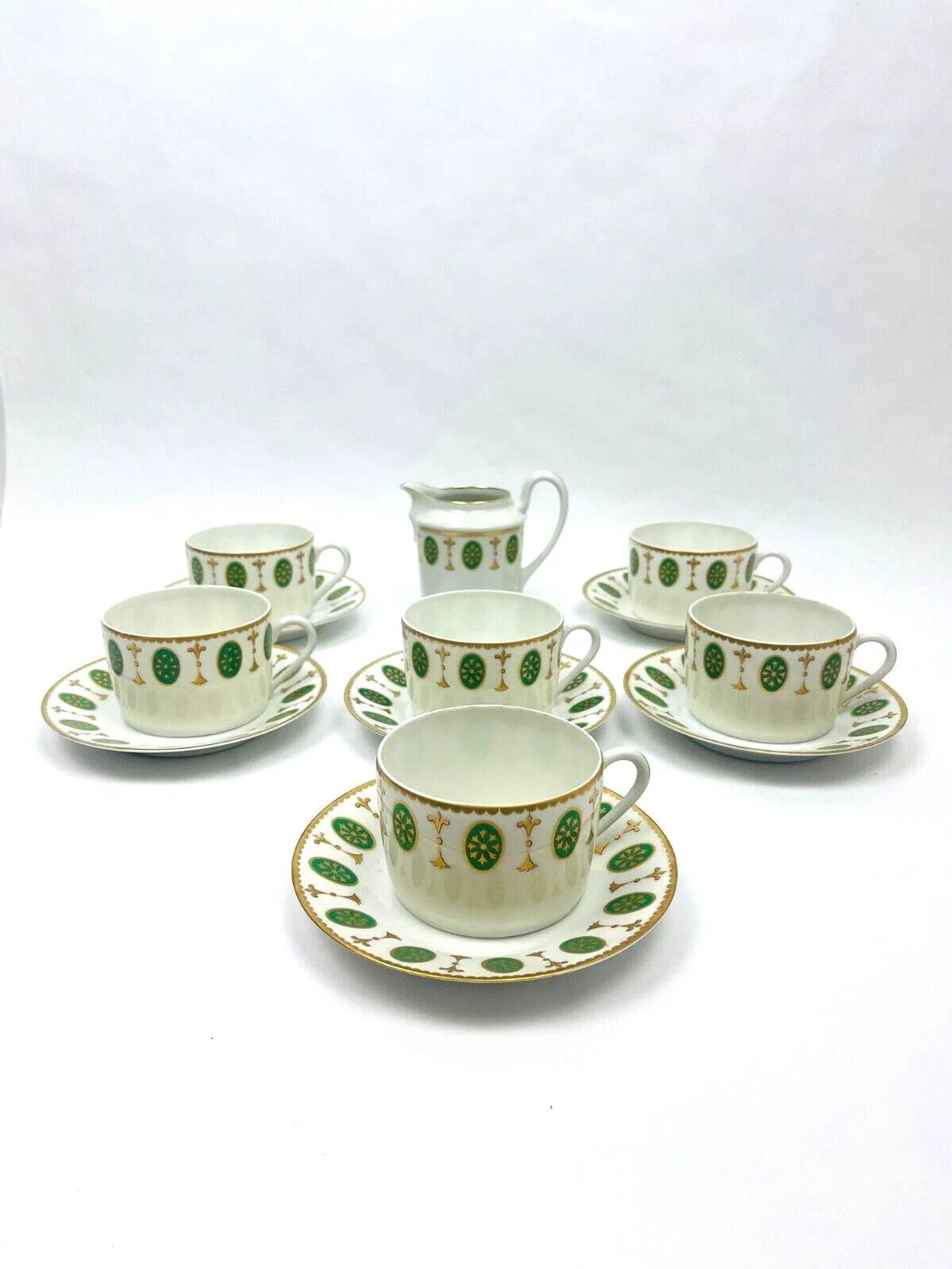 Set of 6 tea cups and 1 cream jug in Paris porcelain, Louis XVI decoration.