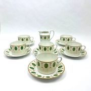 Set of 6 tea cups and 1 cream jug in Paris porcelain, Louis XVI decoration.