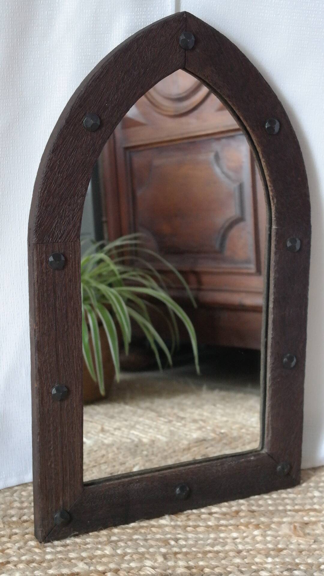 Old handcrafted Gothic style wooden mirror