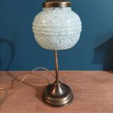 Bedside lamp in room with patinated golden globe Clichy blue