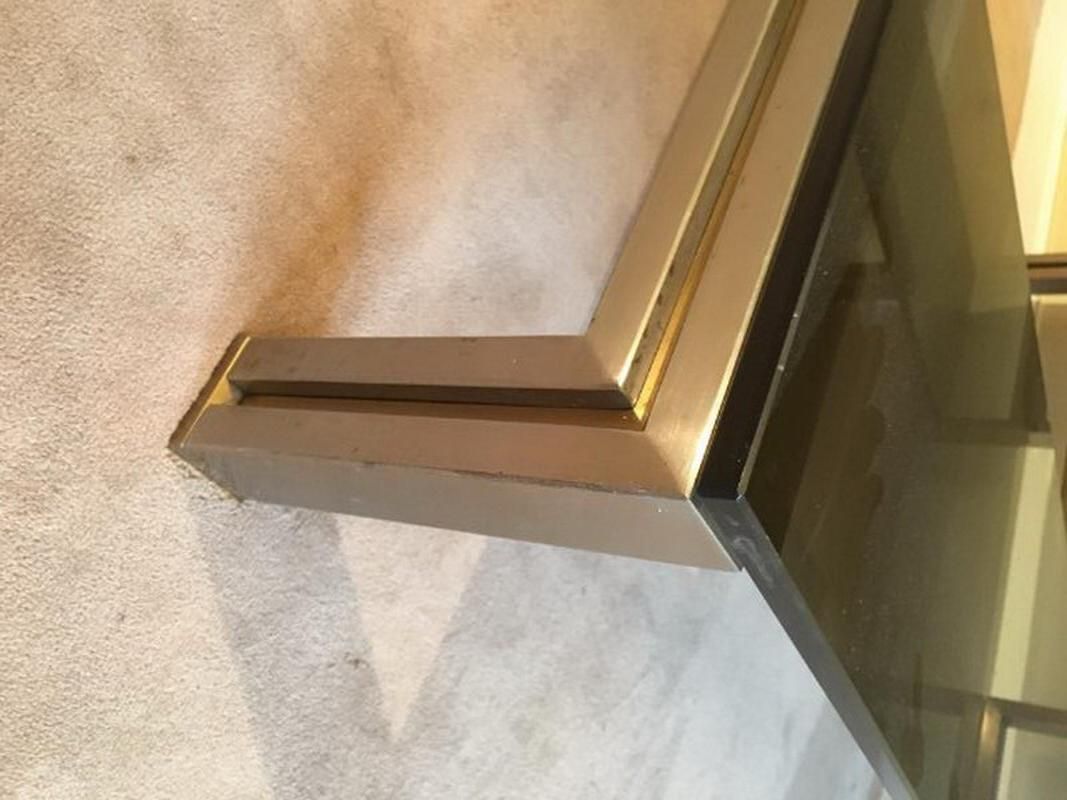 Very nice coffee table in brushed steel and brass