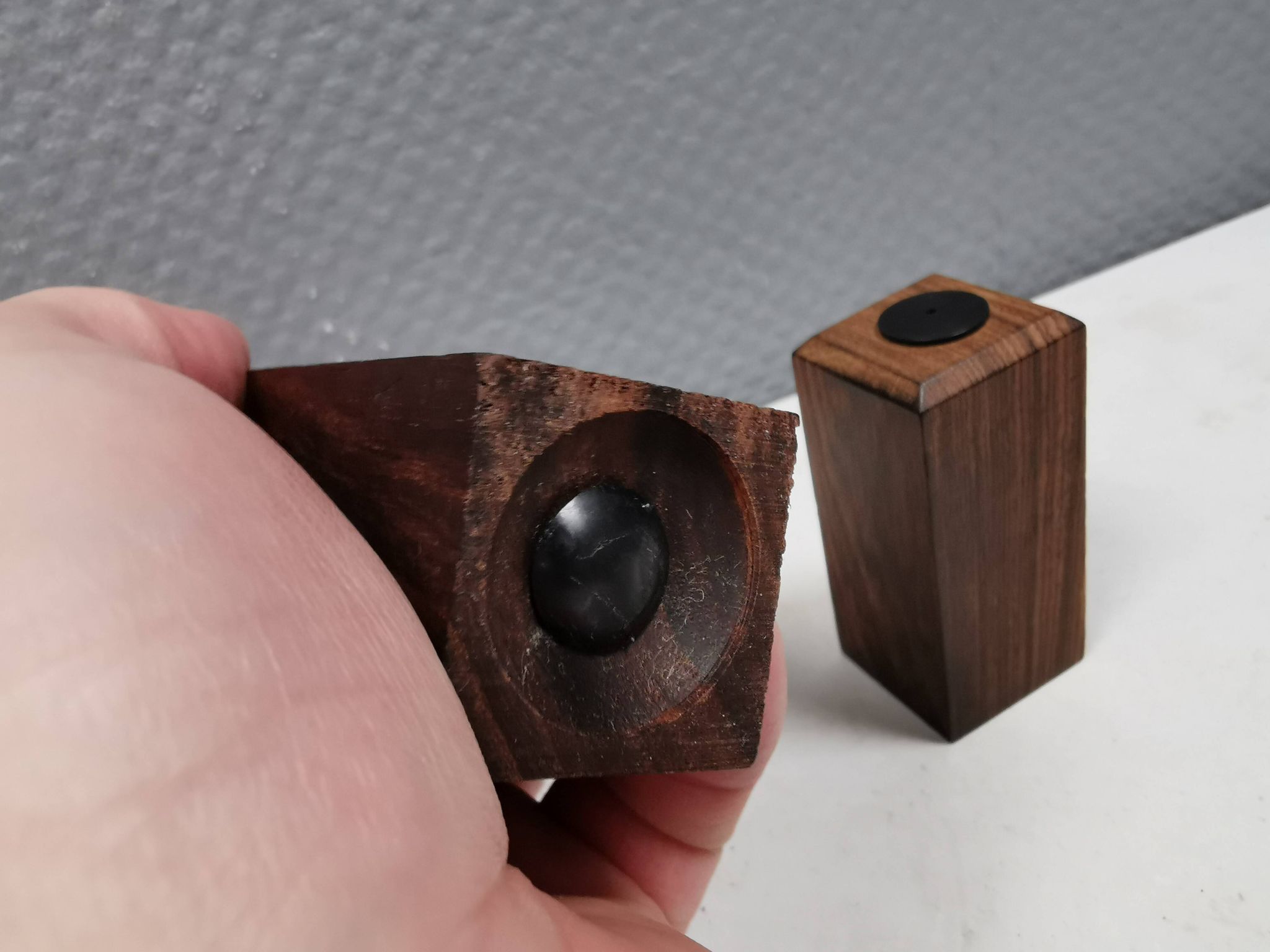 A set of salt and pepper shakers in rosewood