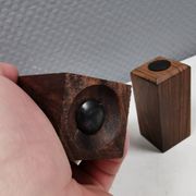 A set of salt and pepper shakers in rosewood