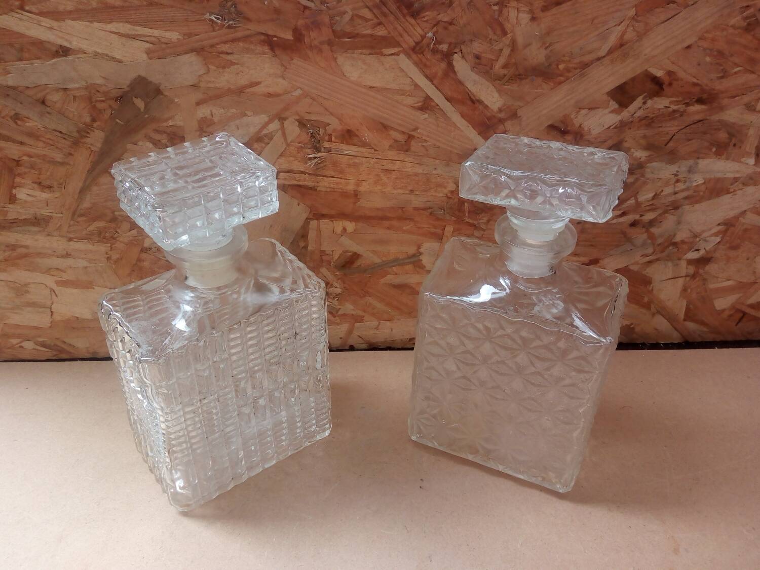 Pair of molded glass whiskey liqueur carafes + vintage stoppers