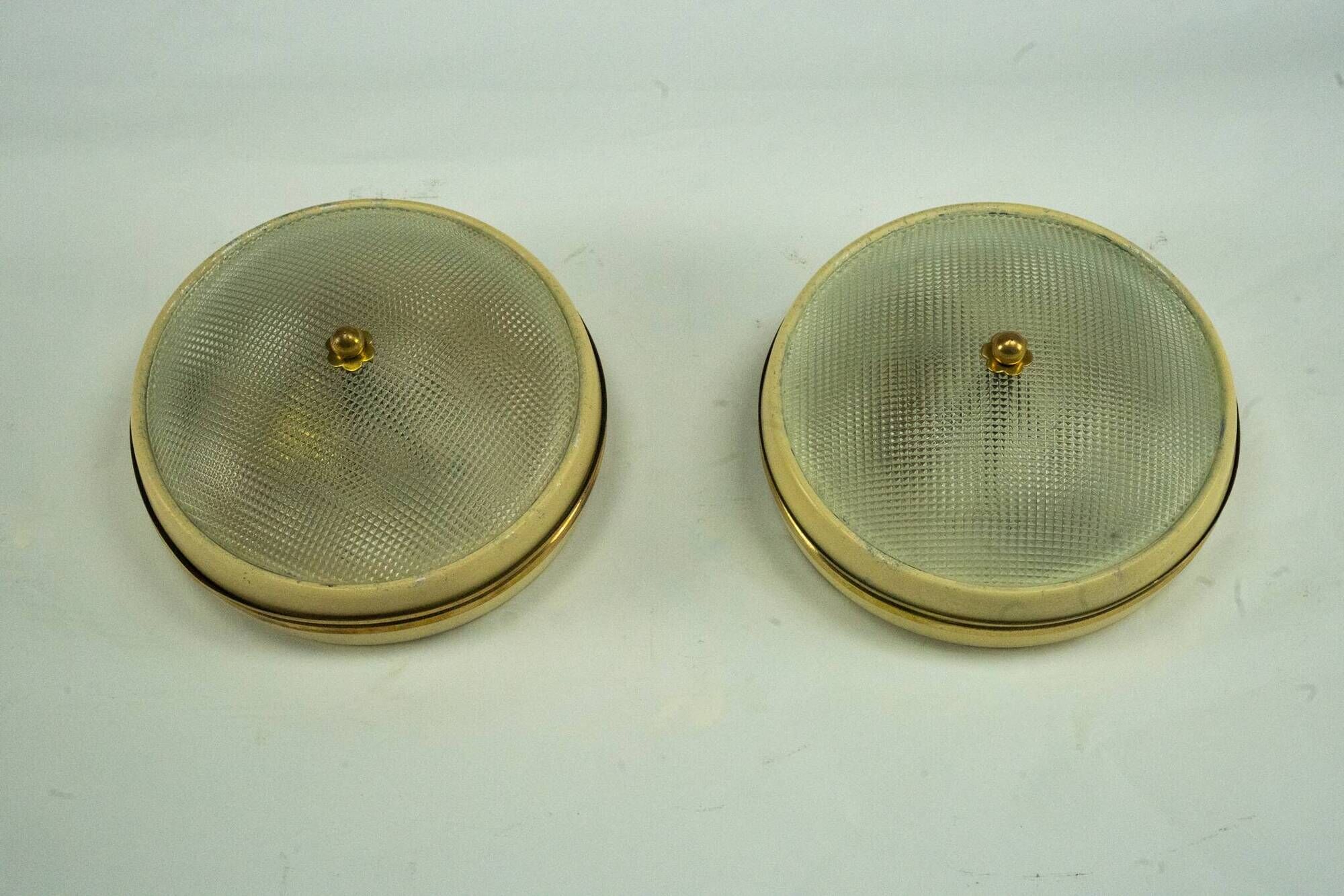 Lumi Milano, pair of wall or ceiling lamps in glass, brass and lacquer, 50s