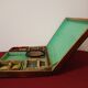 Old mahogany game box with bone tokens, XIXth century
