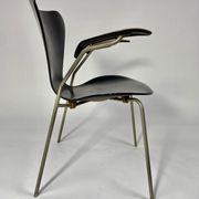 Arn Jocobsen black lacquered wooden armrest chair in the year 50