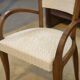 Pair of bridge armchairs in walnut and cream boucle fabric, early 20th century.