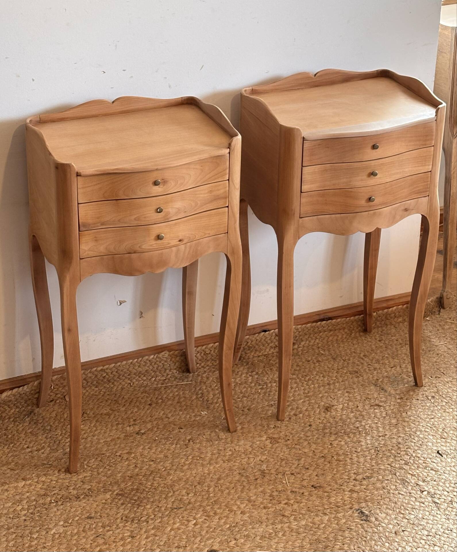 Pair of antique bedside tables / nightstands in raw wood.