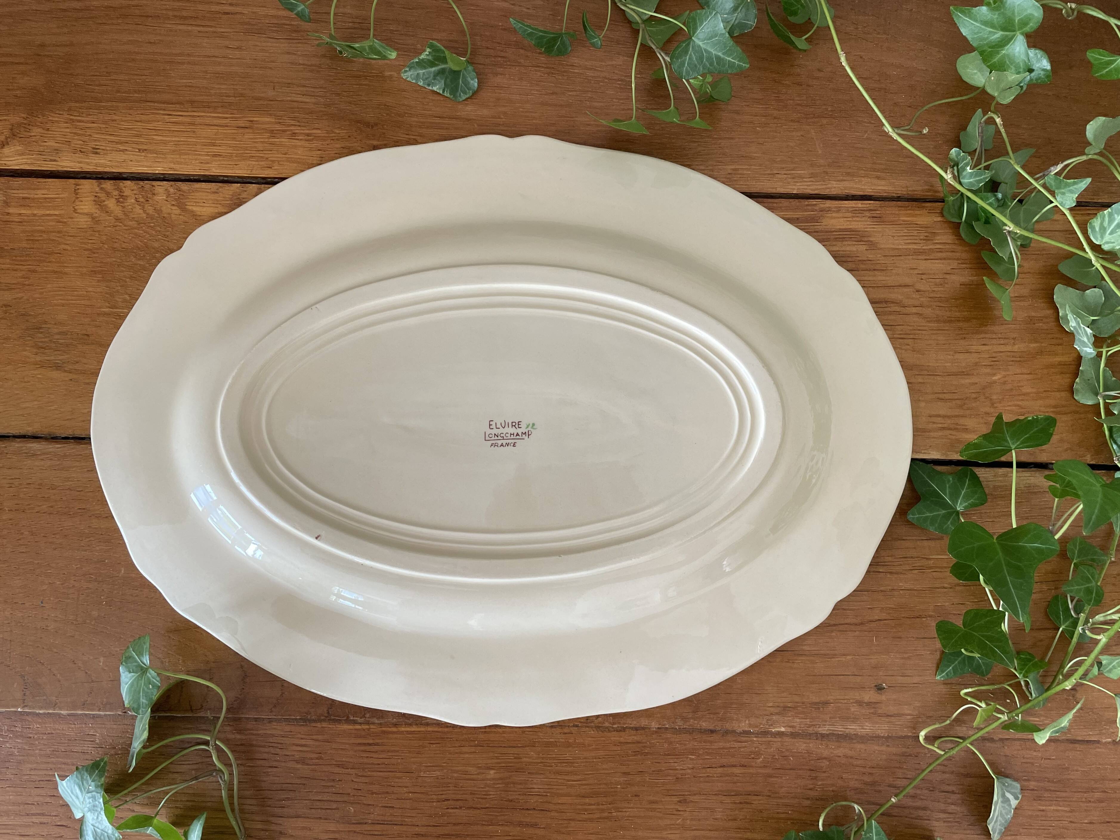 Antique serving dish in Longchamp earthenware.