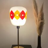 Table lamp with a vintage orange and red "Jacquard" globe in white glass and a golden base
