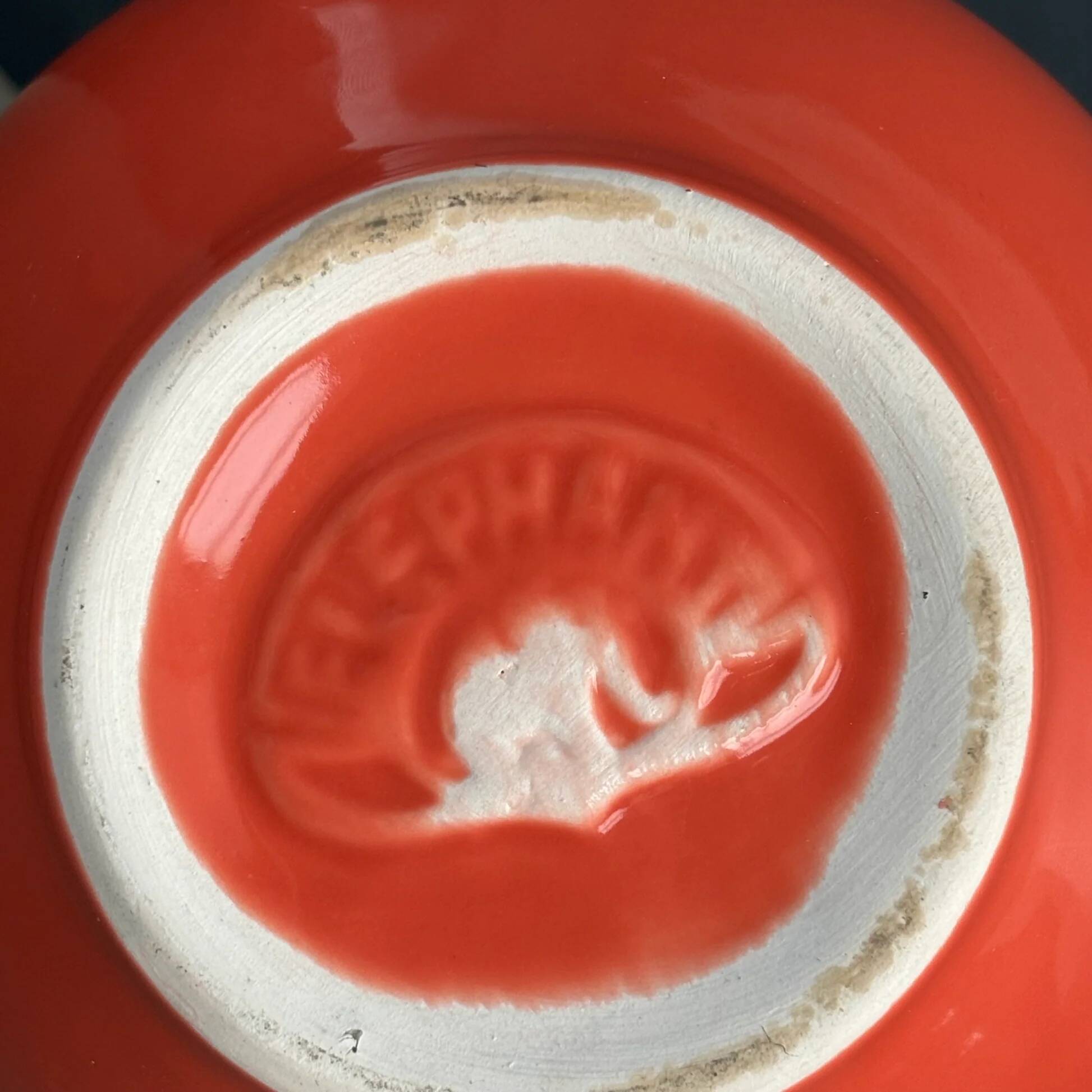 Large coral-coloured elephant teapot.