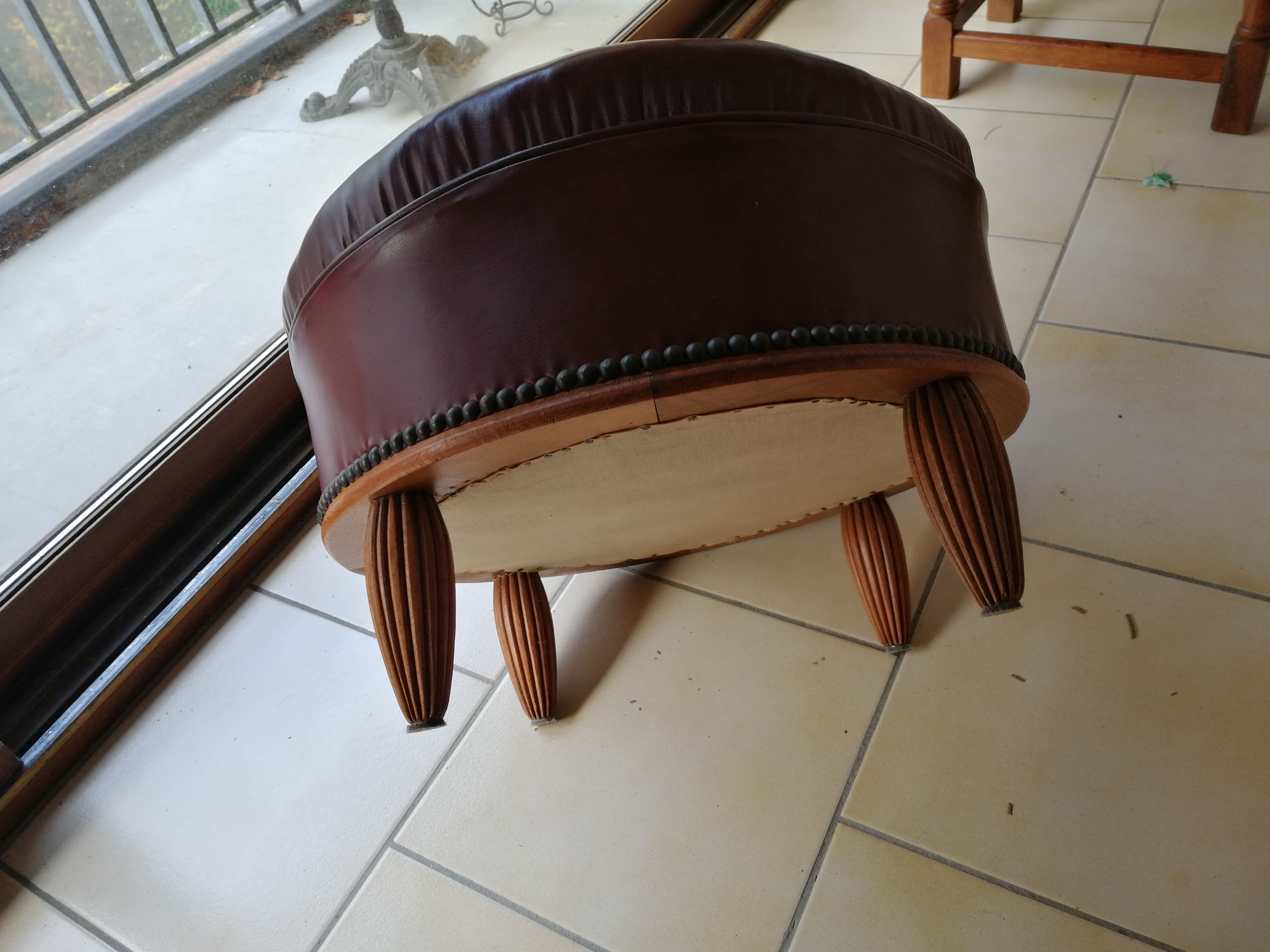 Old leather pouf